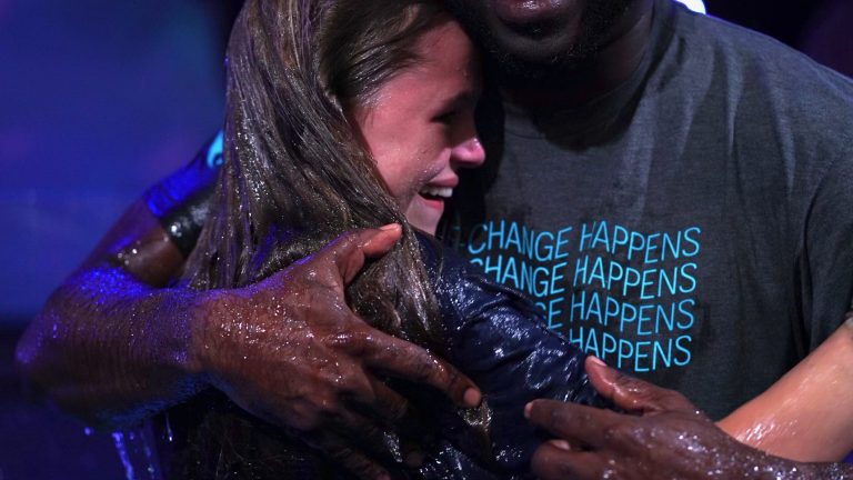 youth pastor baptizes teen girl