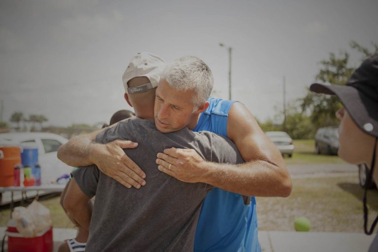 church member giving hug to man in crisis