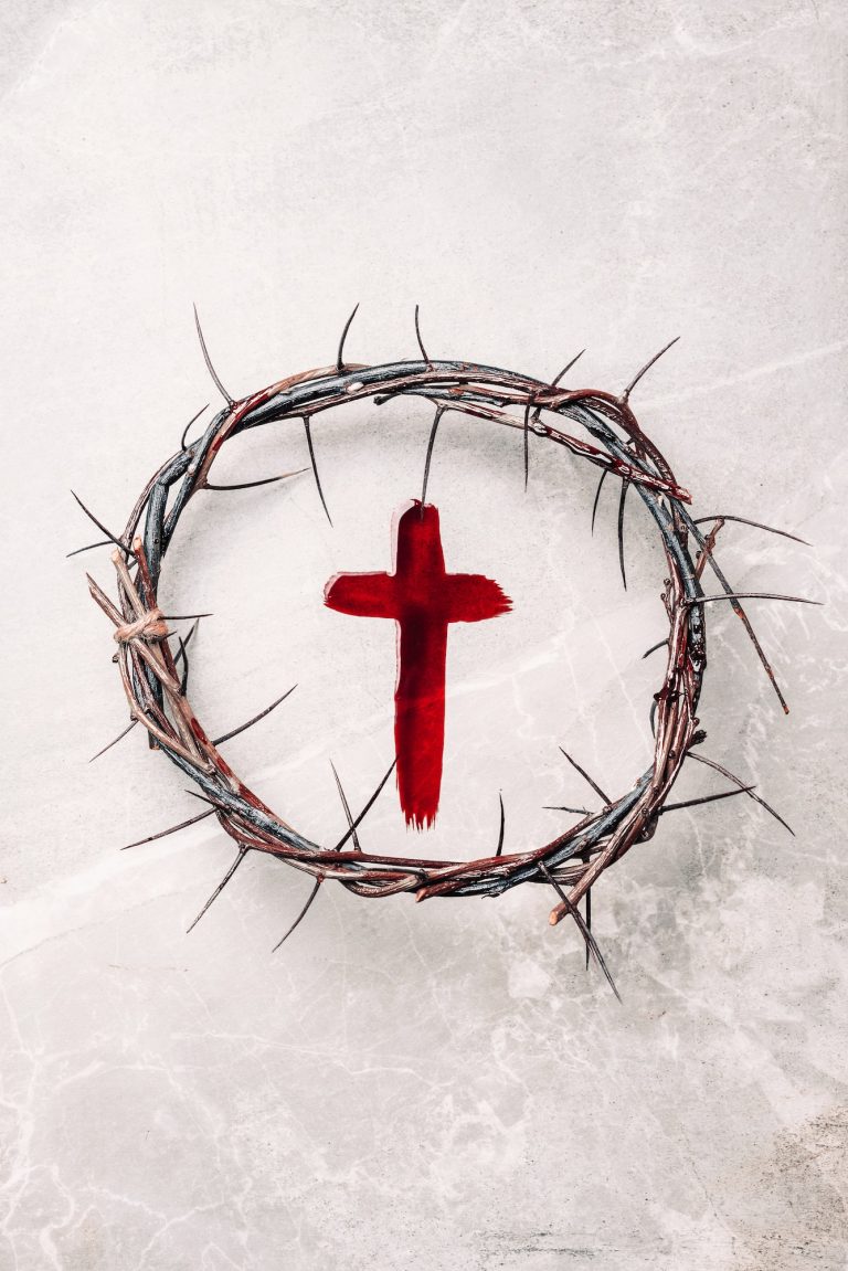 Crucifix made of blood, crown of thorns. Good friday. Easter holiday. Christian cross painted with